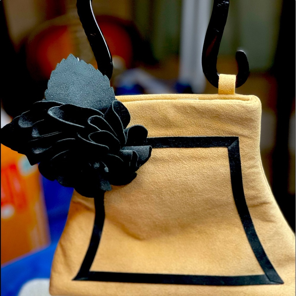 Marigot purse with floral embellishment